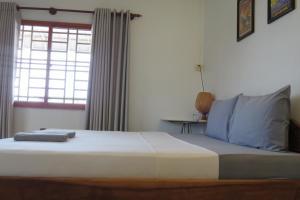 Sorya Guesthouse & Dolphin Tours客房内的一张或多张床位