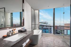 a bathroom with a sink and a large window at Crowne Plaza Shanghai Hongqiao, an IHG Hotel in Shanghai