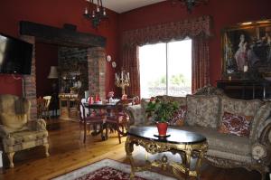 a living room with a couch and a table at Highfield House Guesthouse in Trim