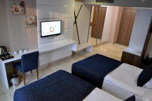 Postel nebo postele na pokoji v ubytování Extenso Hotel