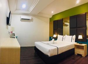 Postel nebo postele na pokoji v ubytování Seeds Hotel Ampang Point
