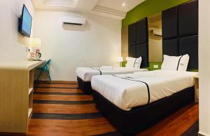 Postel nebo postele na pokoji v ubytování Seeds Hotel Ampang Point