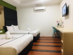 Postel nebo postele na pokoji v ubytování Seeds Hotel Ampang Point