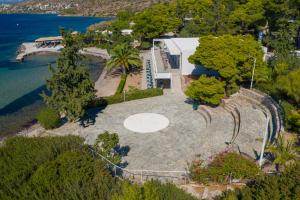 an aerial view of a house with a pool and trees at LaLiBay Resort & Spa - Adults Only in Perdika
