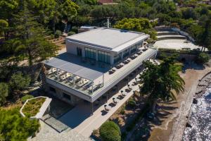 an aerial view of a building with a pool at LaLiBay Resort & Spa - Adults Only in Perdika