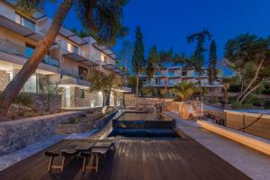 a swimming pool in the middle of a building at LaLiBay Resort & Spa - Adults Only in Perdika