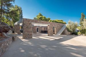 a brick building with a stone archway at LaLiBay Resort & Spa - Adults Only in Perdika