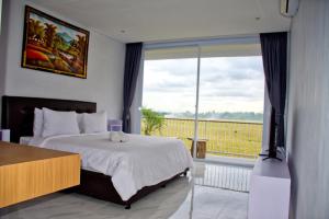 Postel nebo postele na pokoji v ubytování Beluran Panorama