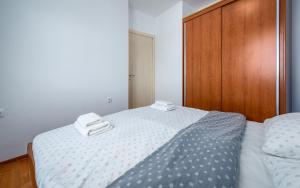 Postel nebo postele na pokoji v ubytování Adria Apartments