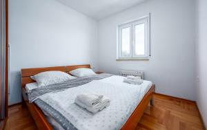 Postel nebo postele na pokoji v ubytování Adria Apartments