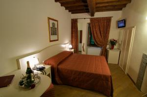 Postel nebo postele na pokoji v ubytování Hotel Villa San Michele