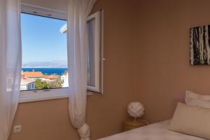 Ένα ή περισσότερα κρεβάτια σε δωμάτιο στο Apartments Adrijana