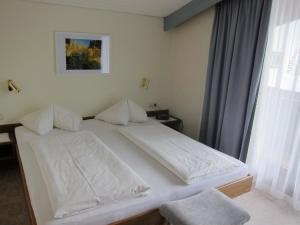Voodi või voodid majutusasutuse Appartements Koffler toas