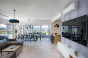 a living room with a couch and a table at Villa LEA MAGDALENA in Malinska