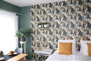 Rúm í herbergi á Bed & Breakfast Hotel Zandvoort