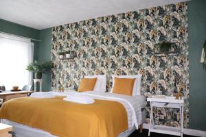 Rúm í herbergi á Bed & Breakfast Hotel Zandvoort