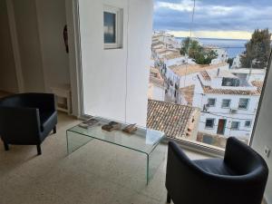 Ein Sitzbereich in der Unterkunft Hostal Fornet Altea