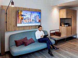 Telewizja i/lub zestaw kina domowego w obiekcie Novotel Parma Centro