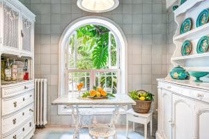 a kitchen with a table with fruit on it at Villa Prestige '50 in Capri