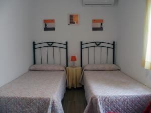 Postel nebo postele na pokoji v ubytování ayapart