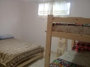 Ένα ή περισσότερα κρεβάτια σε δωμάτιο στο DptosECONOMICOS1
