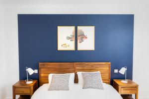 Postel nebo postele na pokoji v ubytování Résidence du Phare - 4 appartements - 2 chambres - Vue mer ou Terrasse