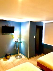 Postel nebo postele na pokoji v ubytování Bogotá Rooms Heroes