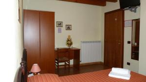 Letto o letti in una camera di Agriturismo Ai Due Volti
