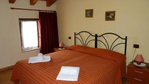 Letto o letti in una camera di Agriturismo Ai Due Volti