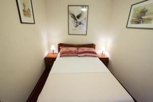 מיטה או מיטות בחדר ב-Apartments & Rooms Vienna