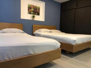 Postel nebo postele na pokoji v ubytování Bogotá Rooms Heroes