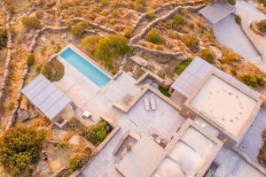 an overhead view of a house with a swimming pool at Agrikea in Korissia