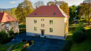 an aerial view of a house with a red roof at Apartament LENA III Deluxe in Kowary +5 photos