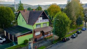 an overhead view of a house with cars parked on the street at Dom do Wynajecia Lena in Kowary