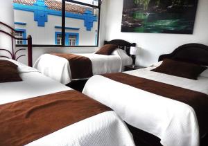 Letto o letti in una camera di La Merced Plaza Hospedaje