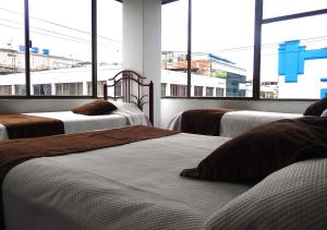 Letto o letti in una camera di La Merced Plaza Hospedaje