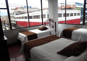 Letto o letti in una camera di La Merced Plaza Hospedaje