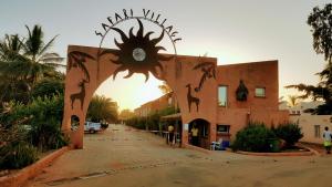 an entrance to a building with a clock on it at Safari Village - Case73 in Saly Portudal