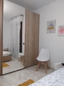 A bed or beds in a room at Sophia' s house appartamento Quartello