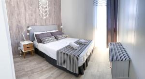 Posteľ alebo postele v izbe v ubytovaní Apartamento Delta Escapada
