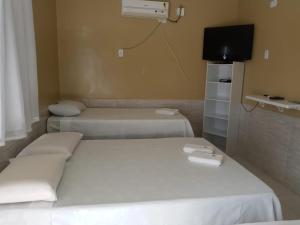 Cama o camas de una habitación en Pousada Nathymar