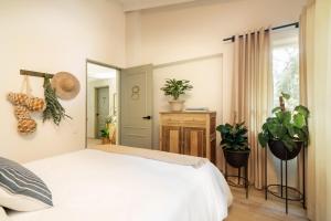 Postel nebo postele na pokoji v ubytování Hotel Quinta Ladera