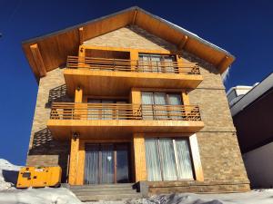 a building with balconies on the side of it at Gudauri Hillsite in Gudauri