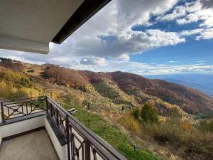 a balcony with a view of a mountain at Milmari Mountain view - I11 in Kopaonik