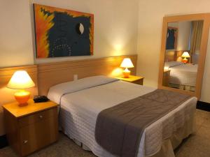 Posteľ alebo postele v izbe v ubytovaní Tropical Barra Hotel