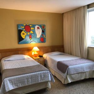 
Cama ou camas em um quarto em Tropical Barra Hotel
