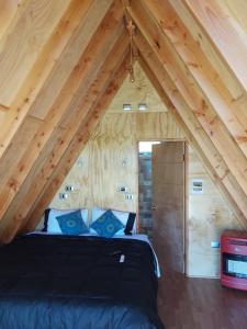 Voodi või voodid majutusasutuse A-FRAME CABIN PUCON toas