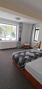 Postel nebo postele na pokoji v ubytování M7 Villa Bed& Bistro