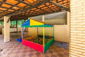 a colorful playset in a room with a building at Pousada Atibaia in Atibaia