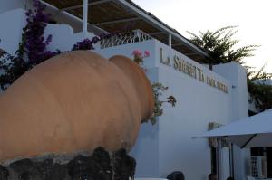 a building with a large vase in front of it at La Sirenetta Park Hotel in Stromboli